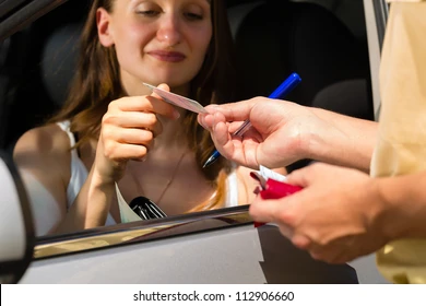 Female handing ID to the police