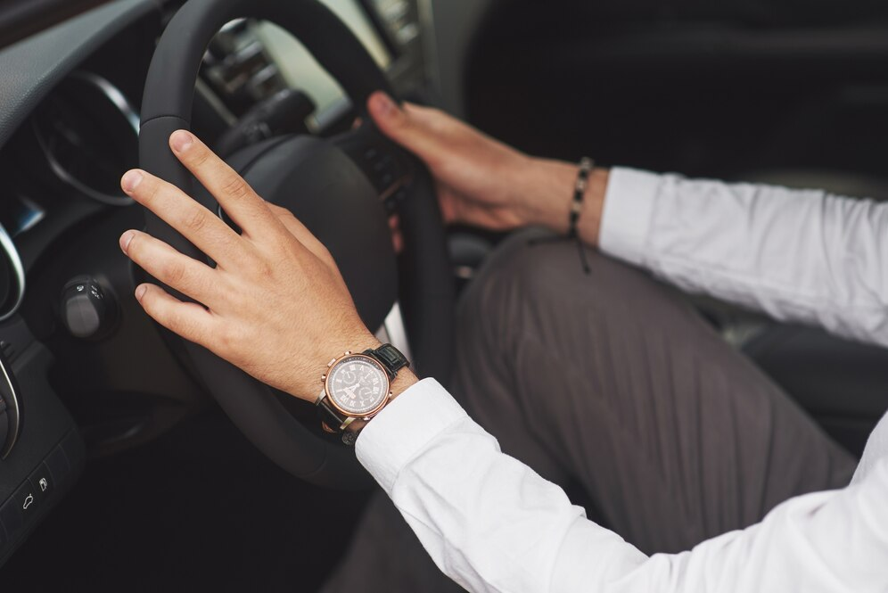 Man holding a steering wheel